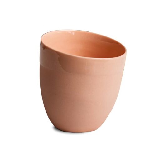 image of a curved coffee cup in the color coral